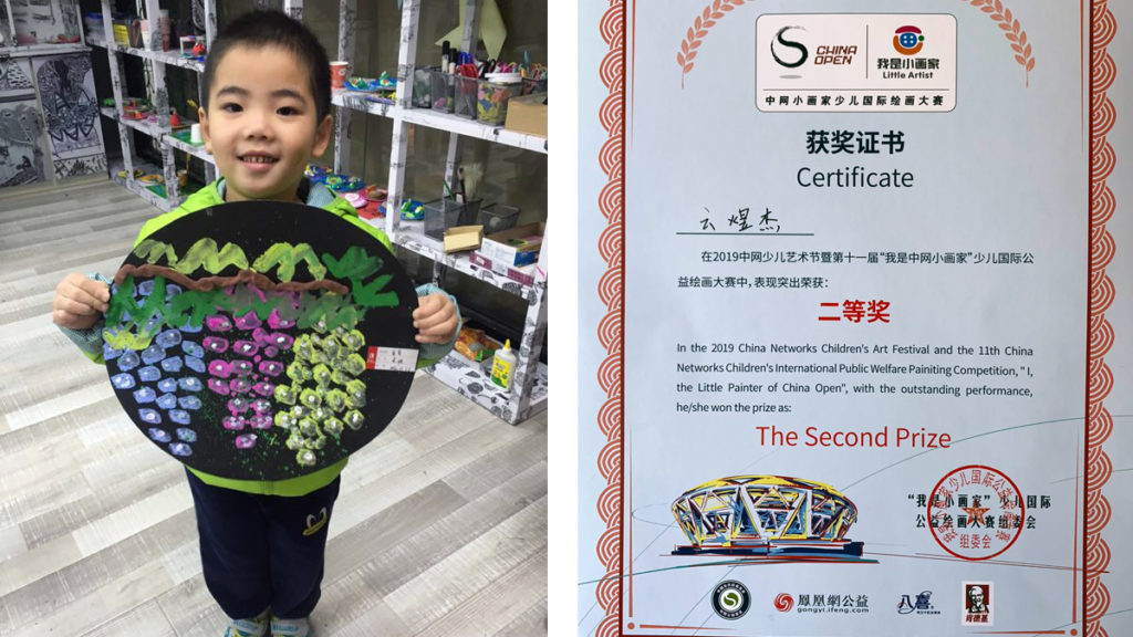 YUJIE YUN WITH HIS DRAWING